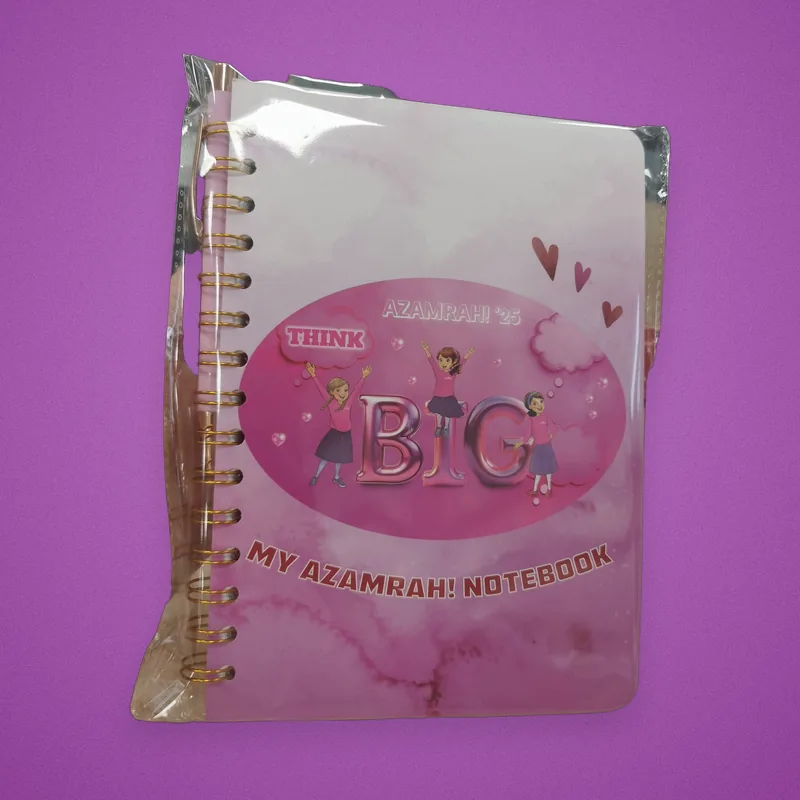 Pink spiral notebook in its sleeve, cover reading 'My Azamrah! Notebook'